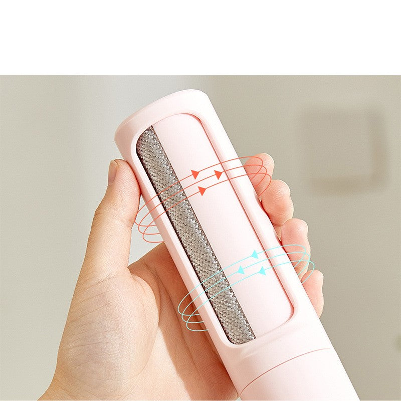 Hand holding a self-cleaning pet hair remover showing collected dog and cat fur