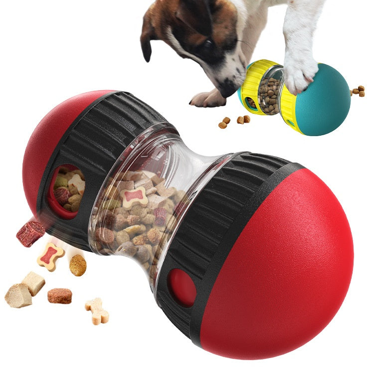 Red treat dispenser dog toy filled with kibble as a dog plays in the background