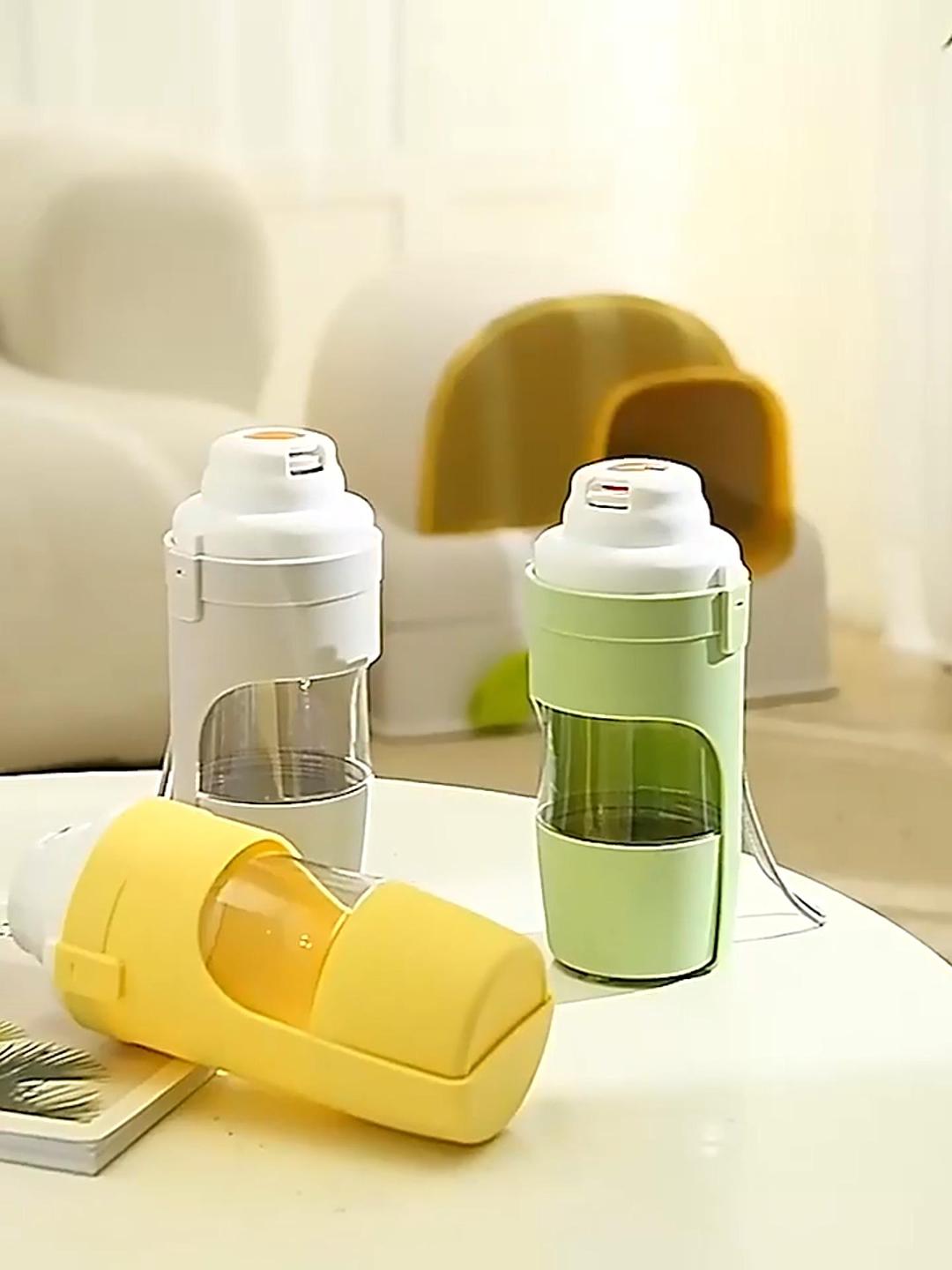 Portable dog water bottles with food cup, part of the dog walking essentials kit