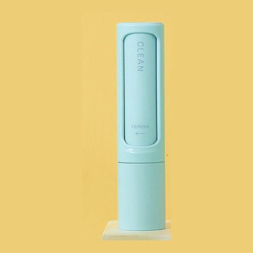 Blue reusable pet hair remover brush in its self-cleaning case